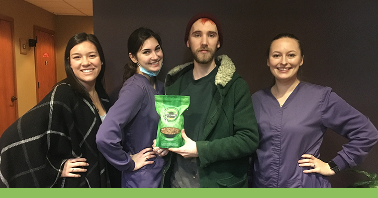 Shoreline Dental staff with patient holding Seattle Granola Company's granola